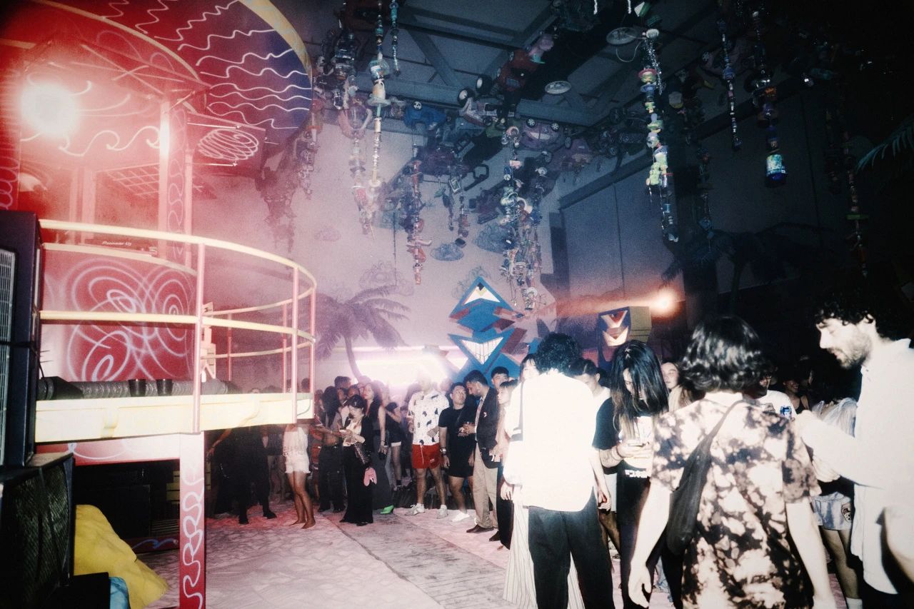Kenny Scharf’s iconic figure is dancing with you in the pool. Photo via Lucy.