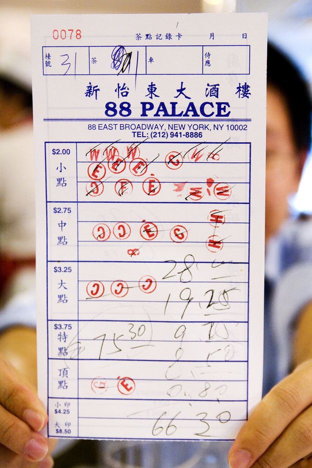 A handwritten waiter’s notepad from a dim sum restaurant in New York City, showing dish orders written only as numbers.
