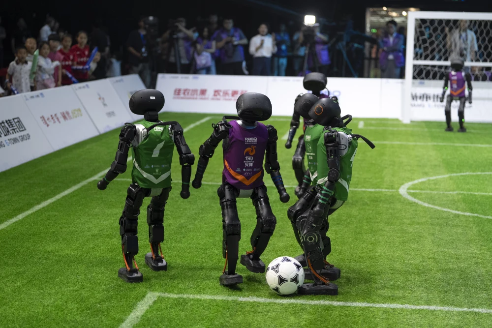 RADII showcases AI robots playing soccer in Beijing.