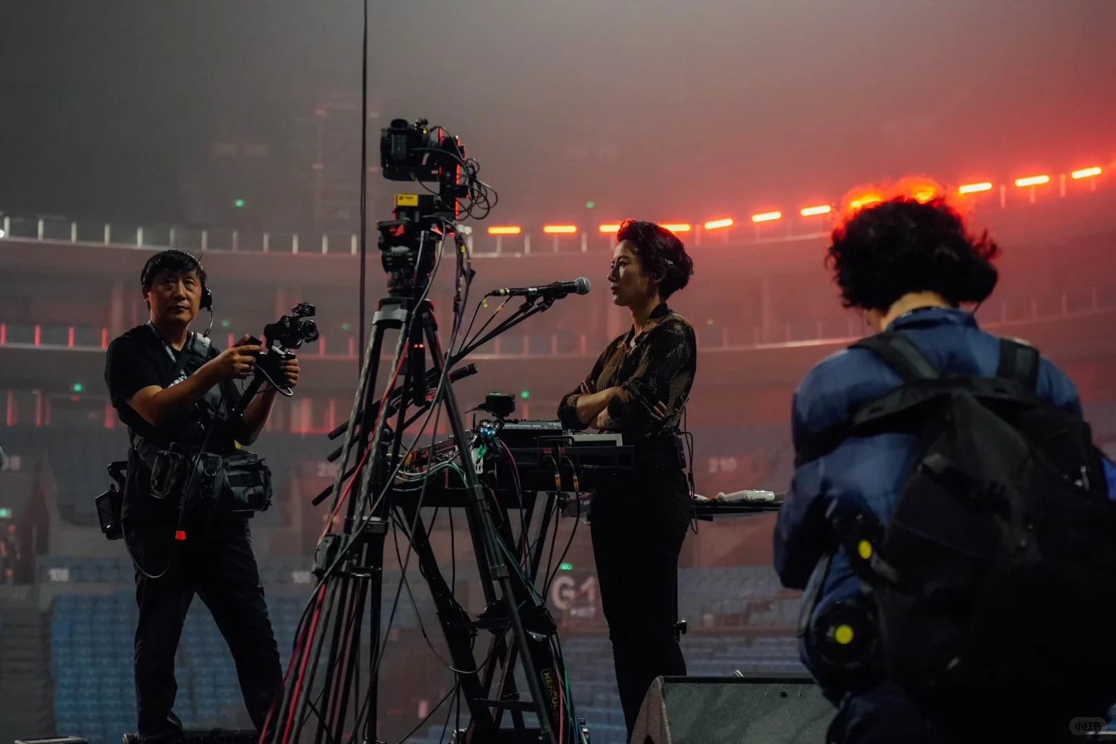 The members of Re-TROs examining the monitor during documentary shooting. Photo via Re-TROs.