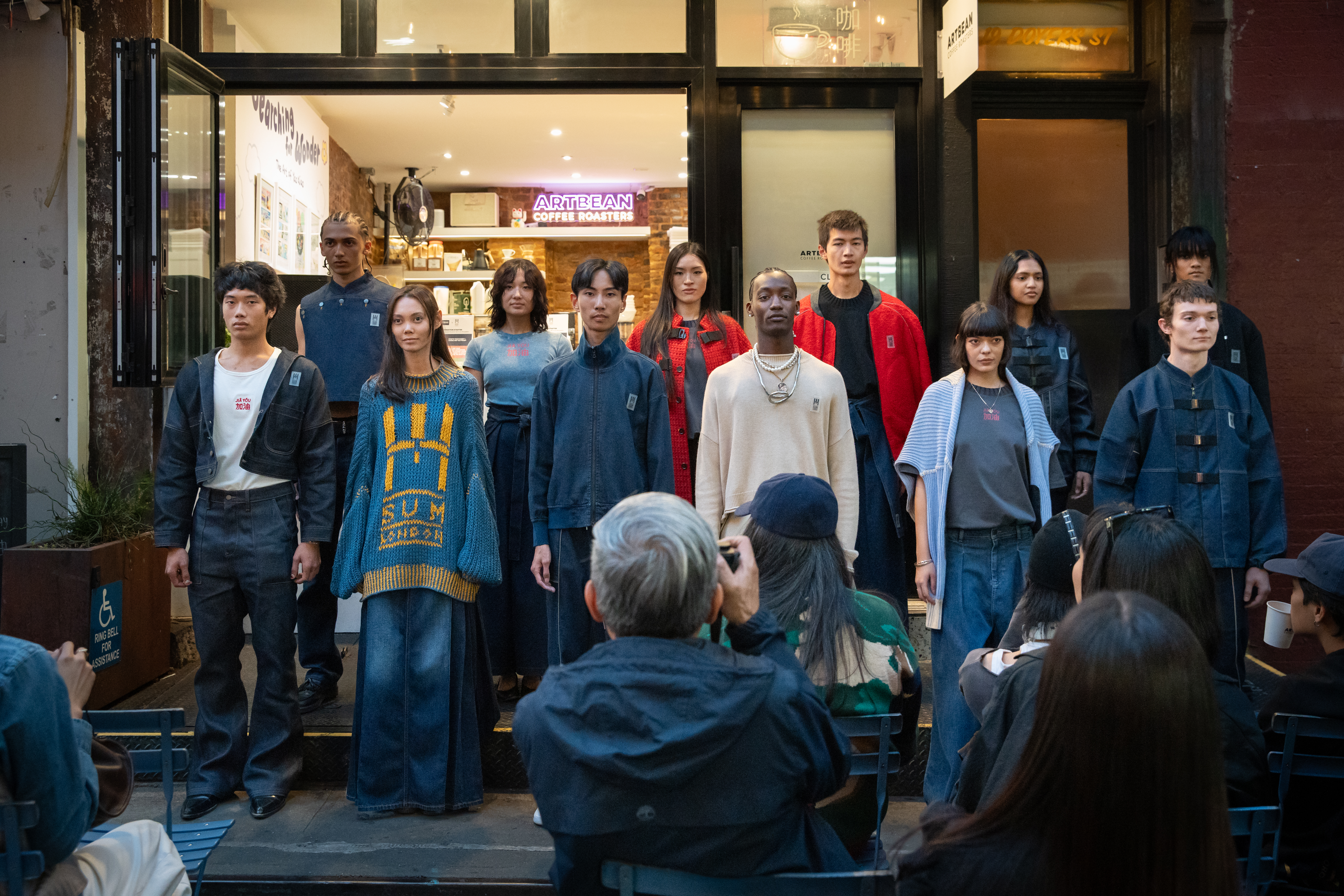 SUM LONDON makes its debut appearance at New York Fashion Week with its JIĀ YÓU collection, highlighting Chinese immigrants' resilience and work ethic.