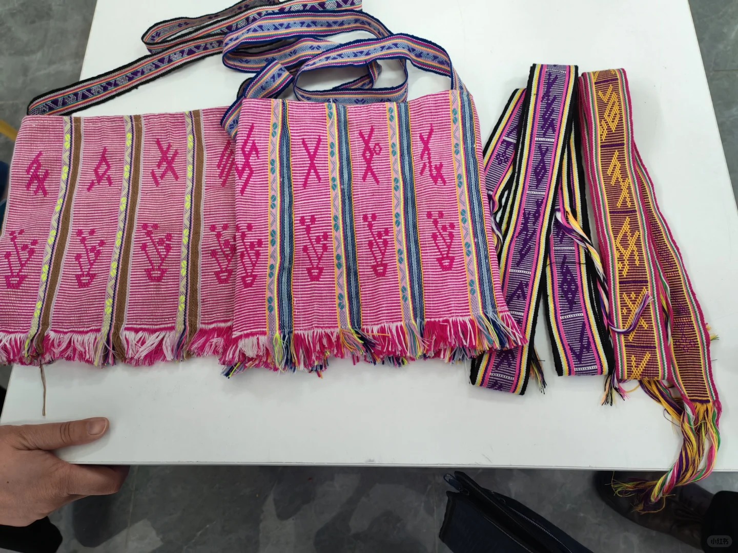 Textile strap embroidered with nüshu characters, used as a traditional bridal dowry item containing written songs and blessings.